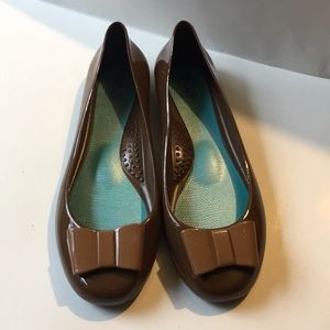Brown flats with a bow